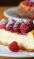 Slice of ricotta cheesecake with fresh raspberries on a plate.