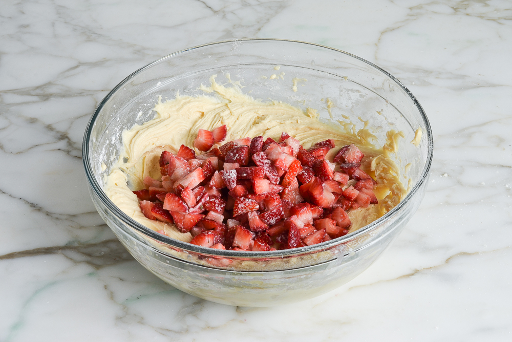 adding strawberries to the batter