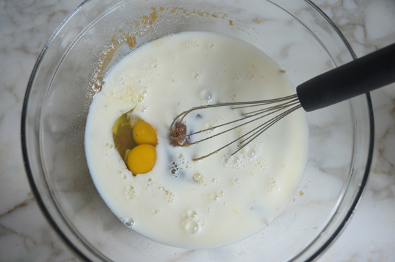 Whisk in a bowl with milk and eggs.