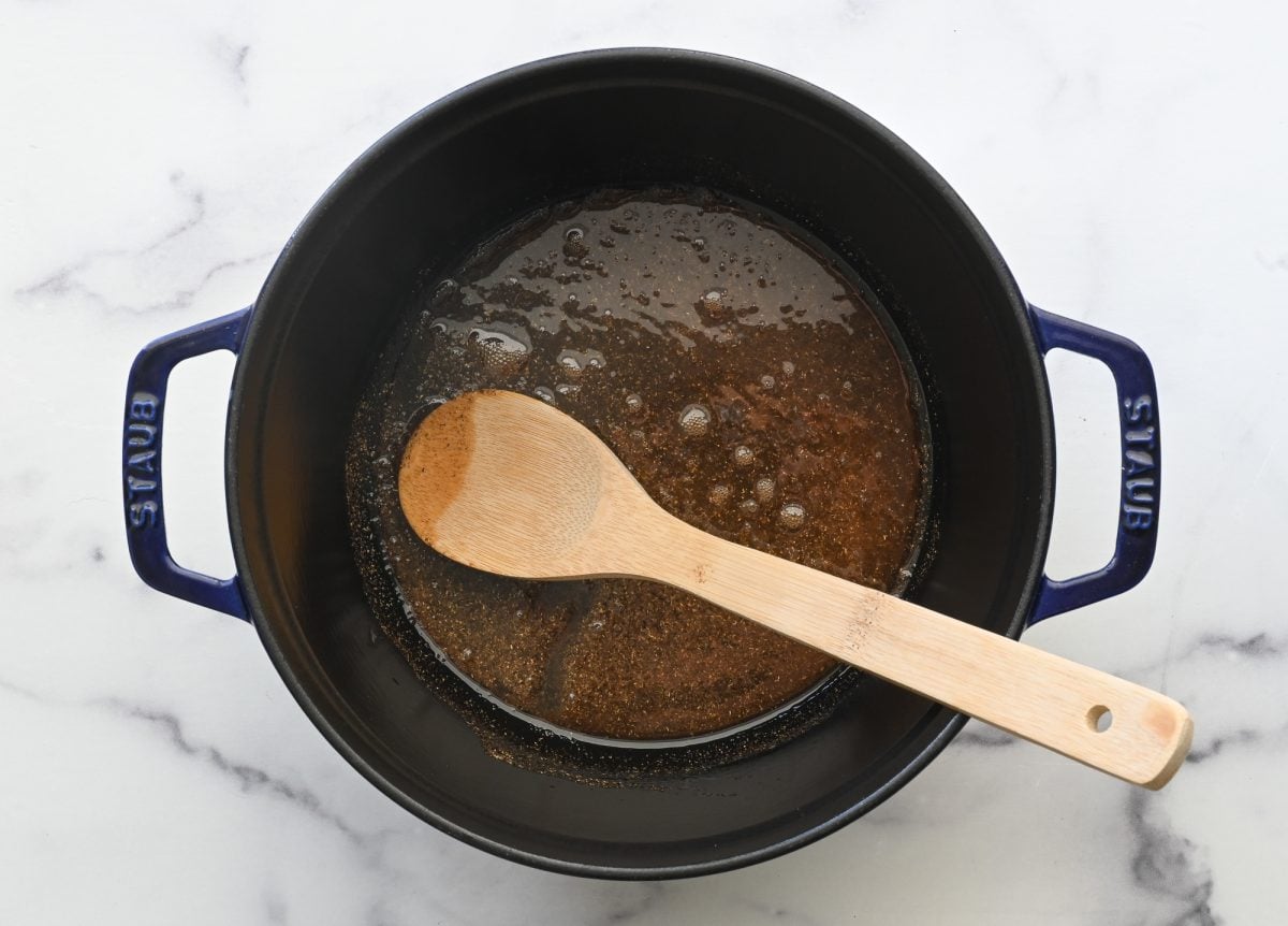 oil and garam masala in dutch oven