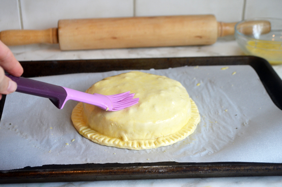 brushing puff pastry with egg wash