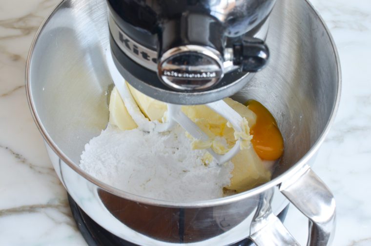 butter, sugar, egg yolk, extract and salt in mixing bowl