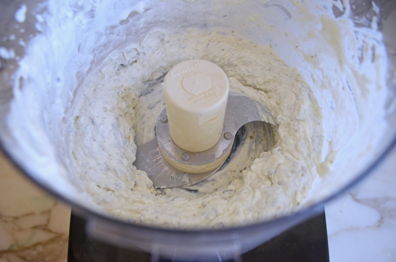 Cream cheese and other dip ingredients processed in a food processor.