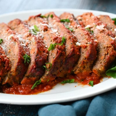 Sliced Italian meatloaf on a platter.