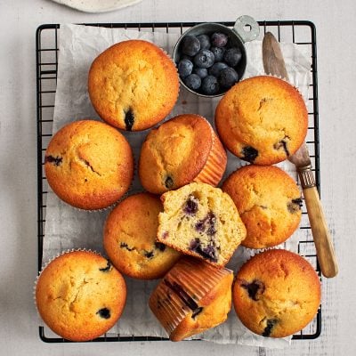 blueberry cornbread muffins cooling on rack