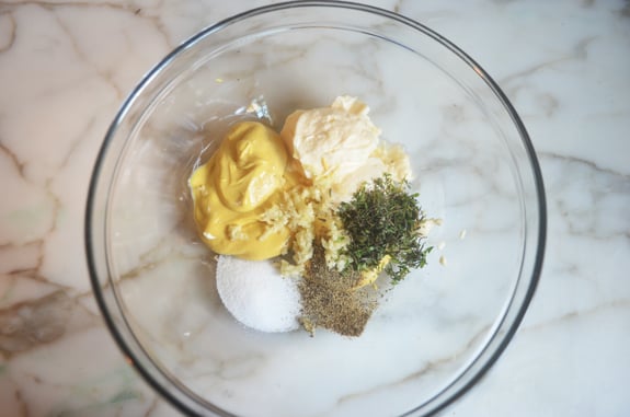 Bowl of unmixed mustard sauce ingredients.