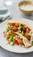 Falafel in pita on a plate.
