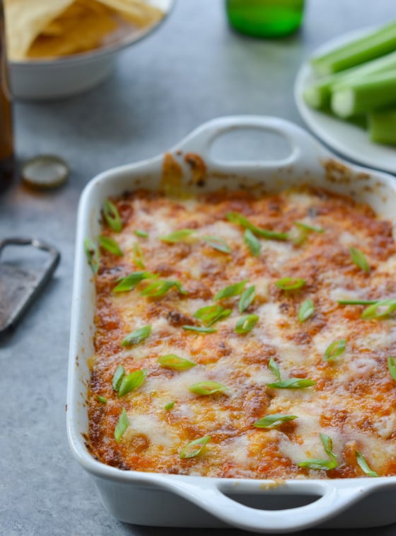 Buffalo chicken dip in a white baking dish.