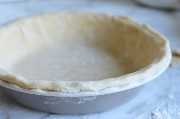 Pie pan lined with pie crust.
