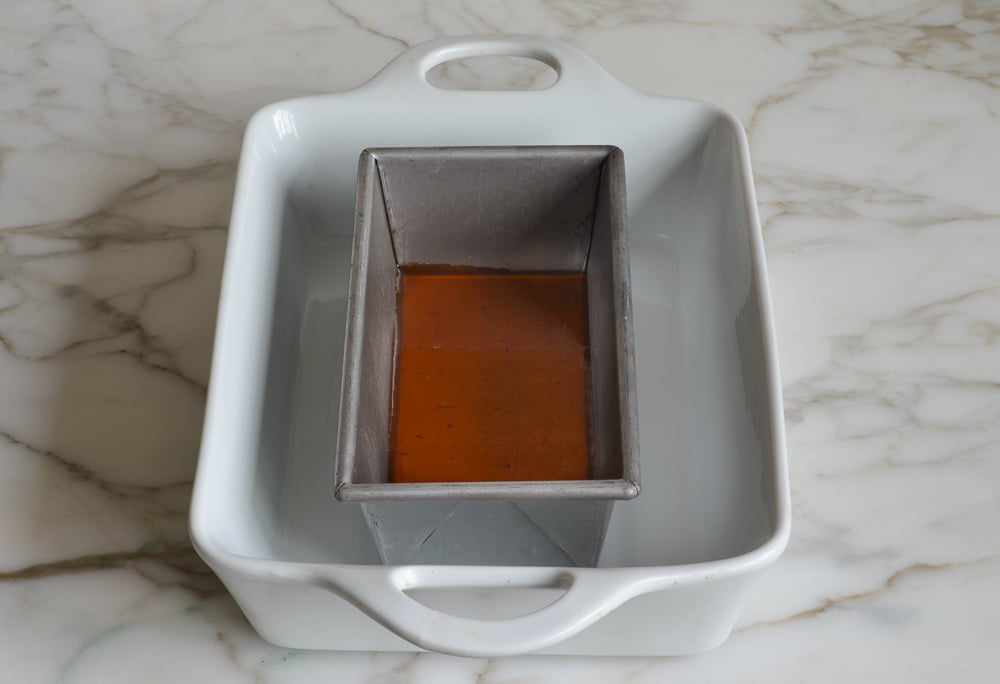 Caramel poured into loaf pan.