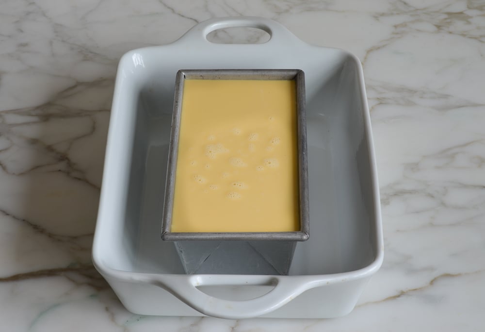 Custard poured into loaf pan and ready to bake.
