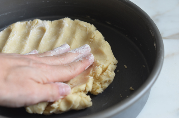 spreading-dough-in-pan