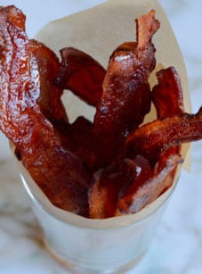 Candied bacon in a glass.