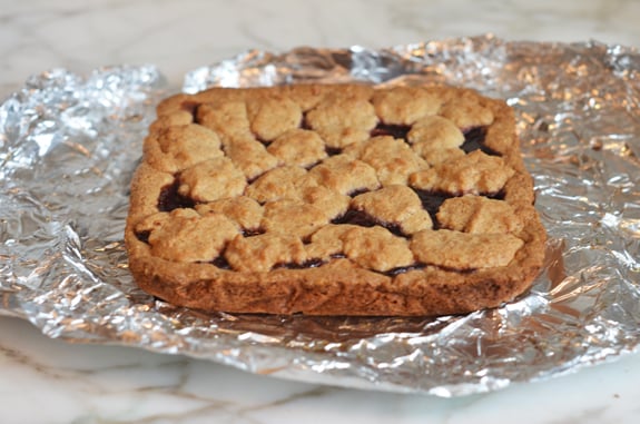 Raspberry jam bars on foil.