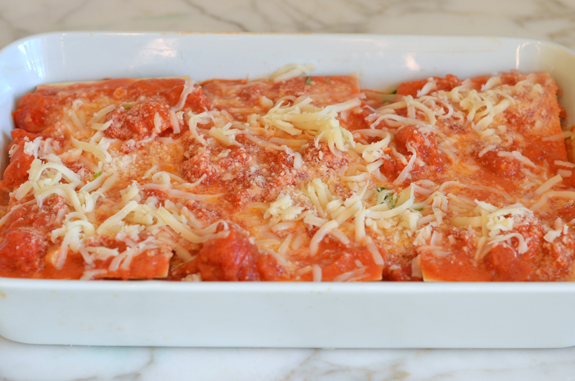 Unbaked lasagna in a baking dish.