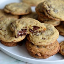 chocolate chunk cookies stacked on plate