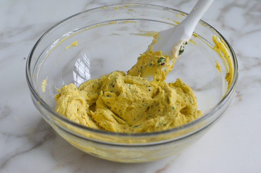 Deviled eggs filling mixed in bowl.