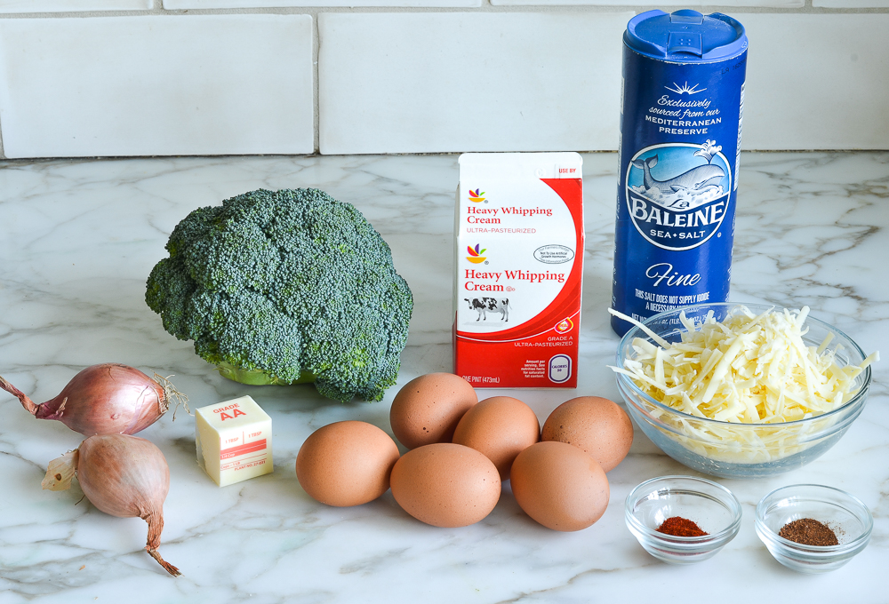 Quiche ingredients including heavy whipping cream, broccoli, and shallots.