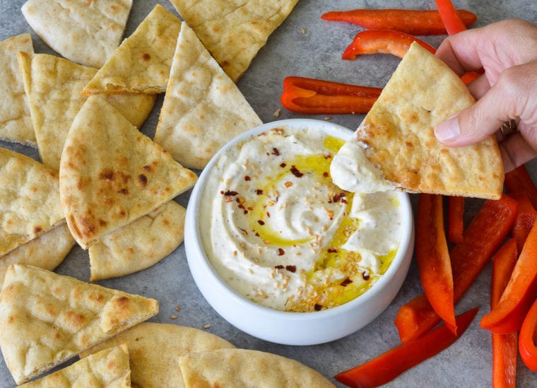 If you're truly outside, tailgating without a grill, cold dips are your best bet. You can keep them in the cooler, don't have to worry about the quality of the dip deteriorating when you're enjoying the tailgate. This whipped feta dip never disappoints and is one of the best cold dip recipes!