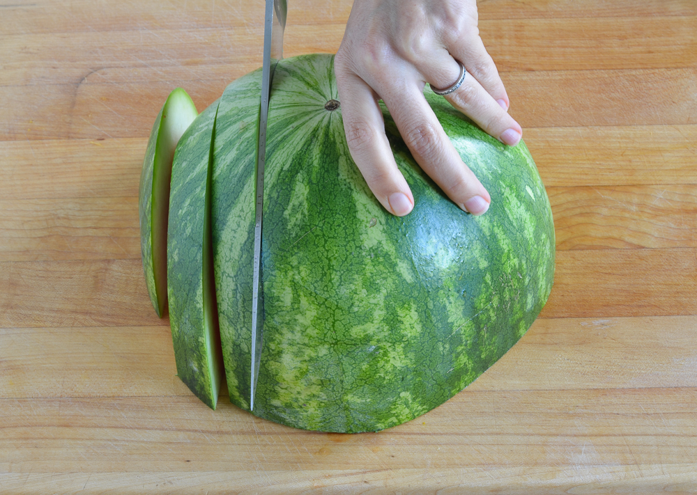 slicing watermelon half