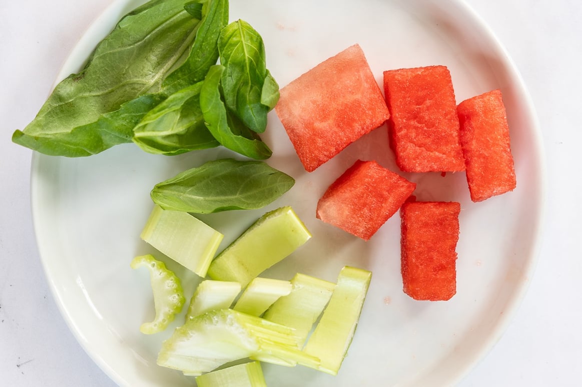 watermelon cubes, celery, and basil reserved for garnish.