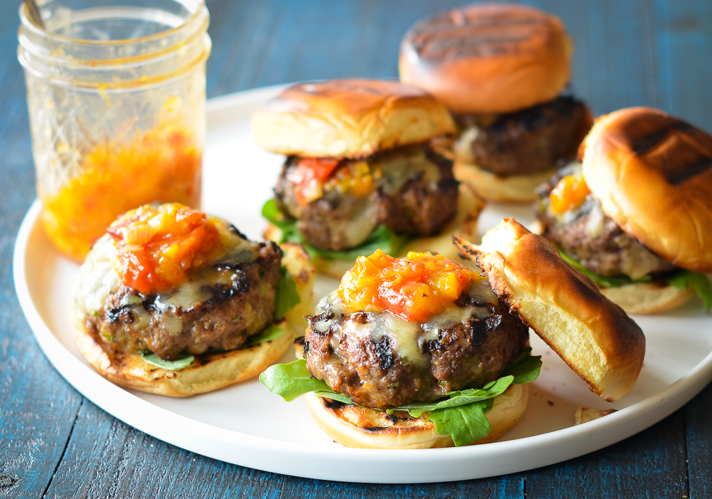 Southwestern cheeseburger sliders on serving platter with peach-tomato jam