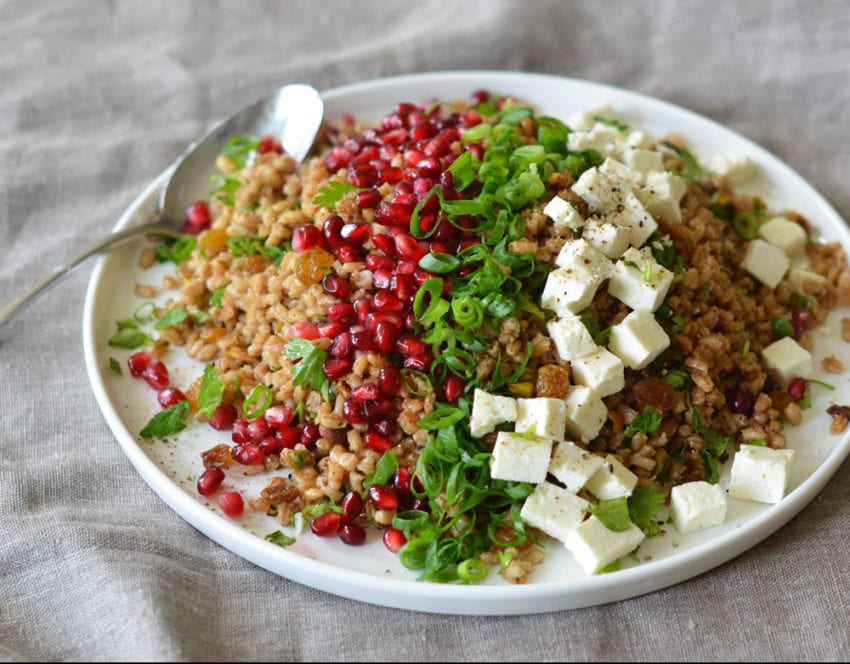 Plate of Egyptian barley salad with pomegranate vinaigrette.