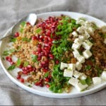 Plate of Egyptian barley salad with pomegranate vinaigrette.