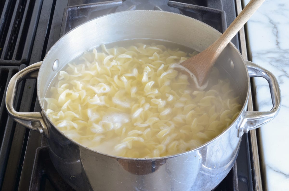 Noodles in a pot of water.