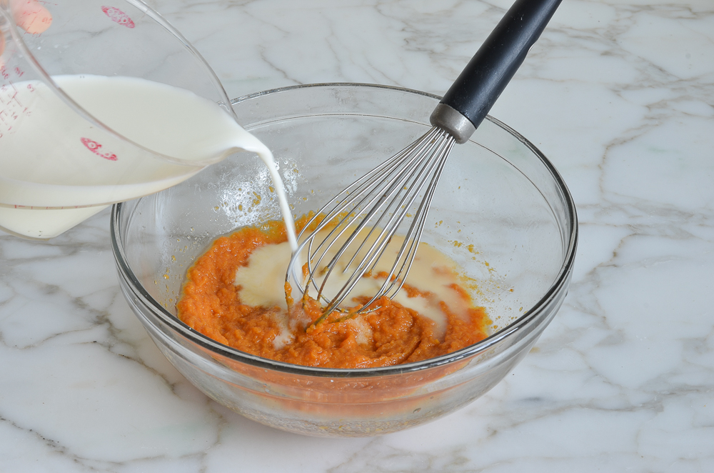 adding milk to wet ingredients for pumpkin pancakes