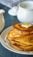 Stack of pumpkin pancakes on a plate.