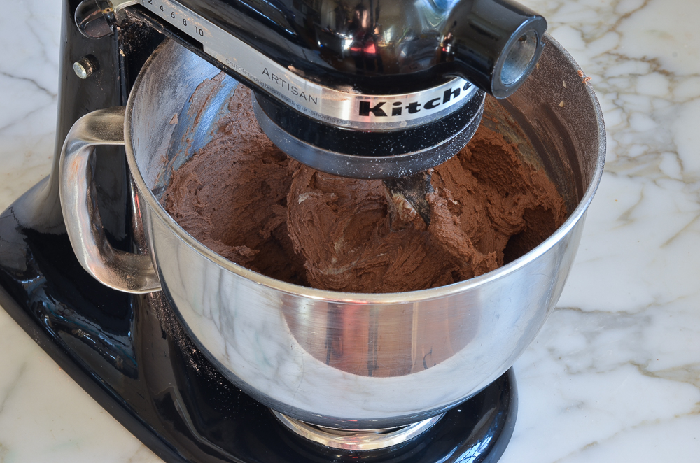 Chocolate dough in a stand mixer.