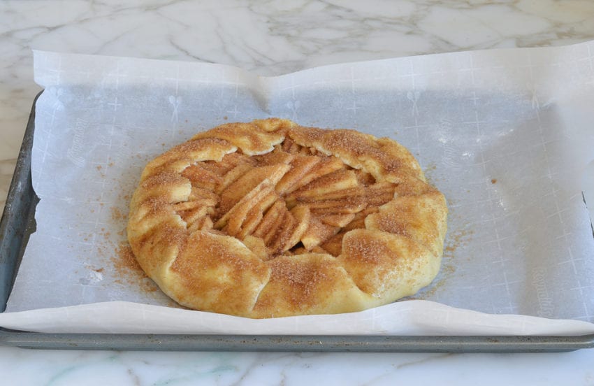 Pastry and apples topped with turbinado sugar.
