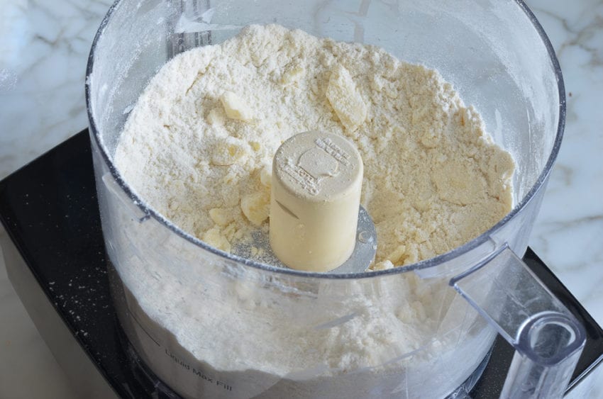 Dry ingredients with pea-sized pieces of butter.