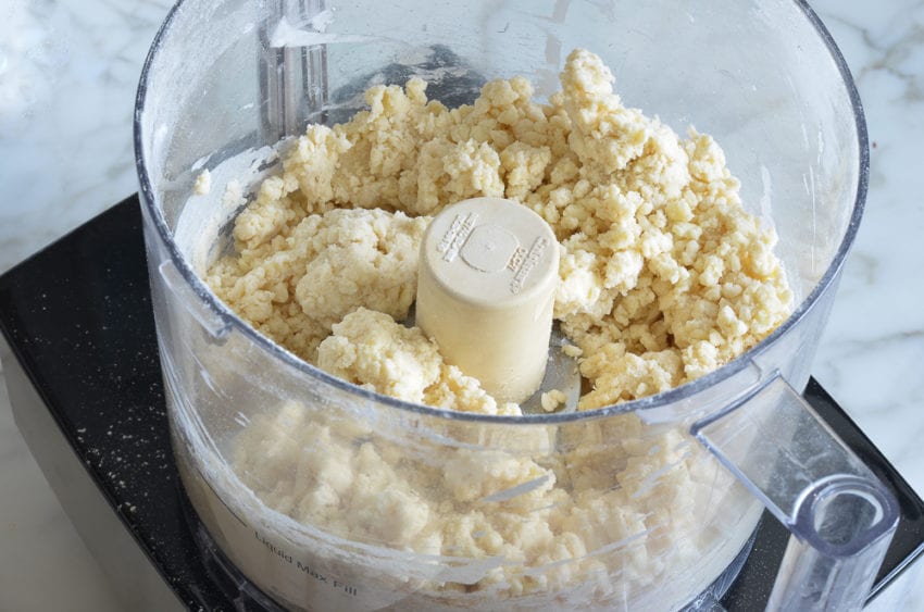 Crumbly dough in a food processor.