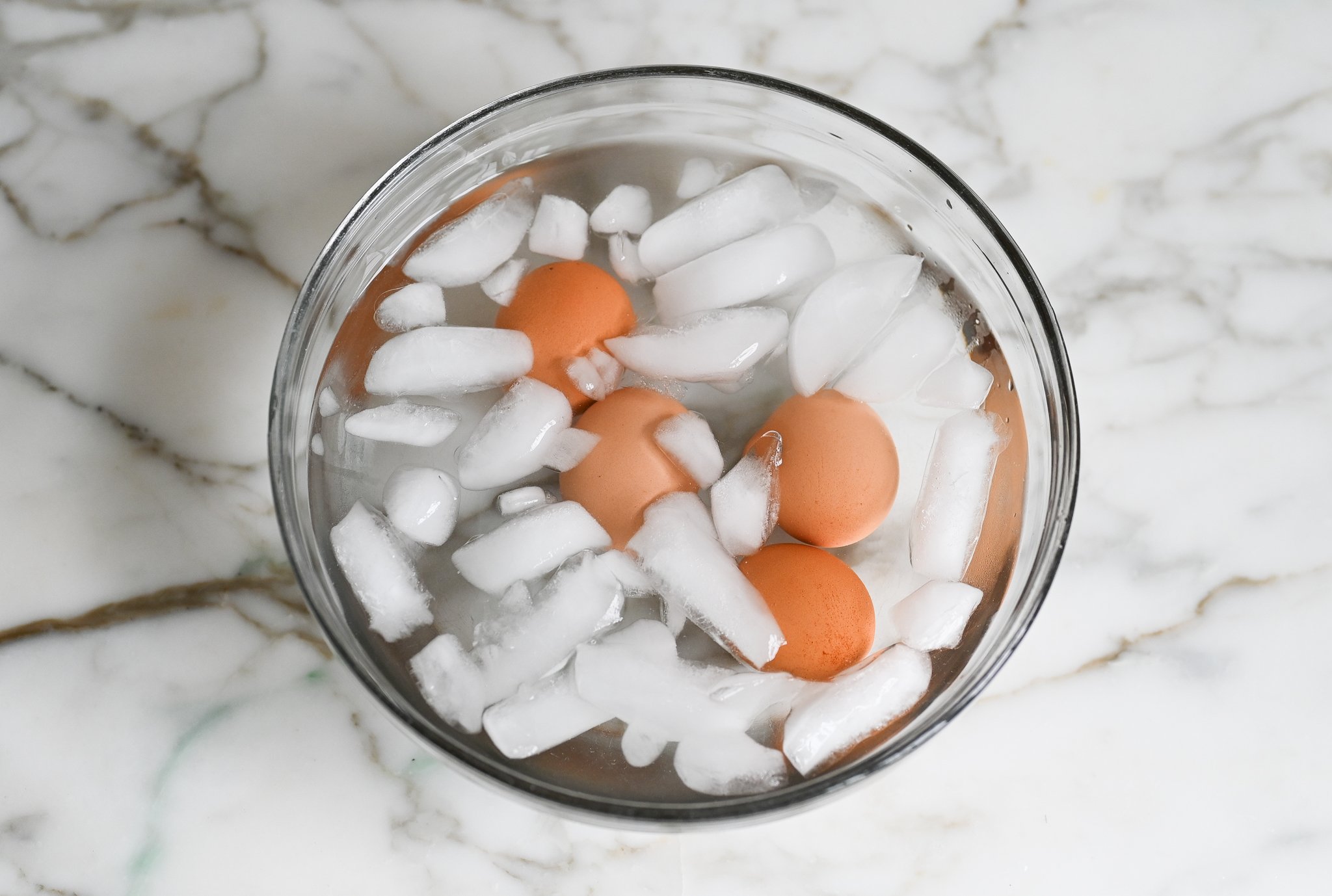 Soft-boiled eggs in an ice bath.