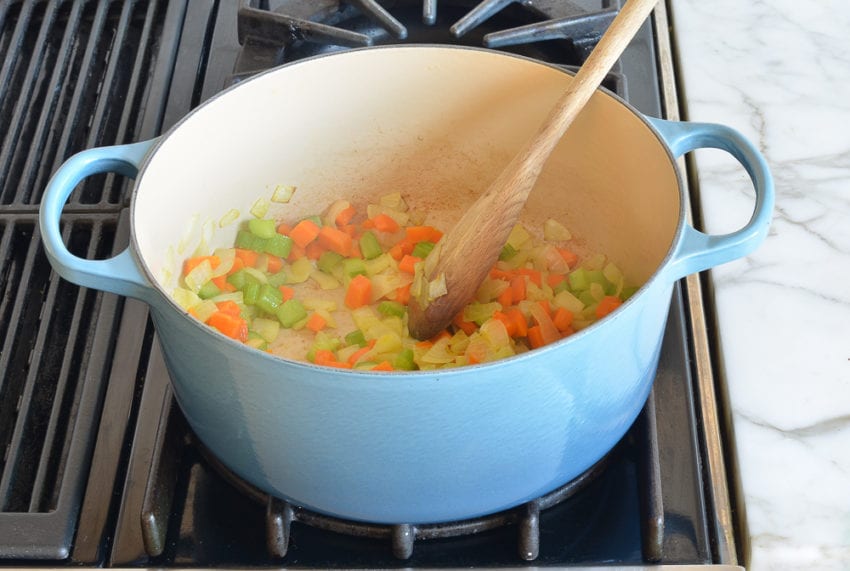 Cooked vegetables in a Dutch oven.