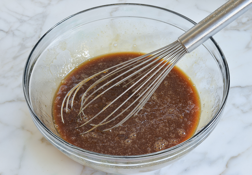 Whisk in a bowl of brown sauce.
