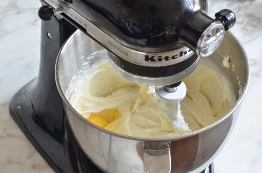 Egg in a stand mixer with a cream cheese mixture.