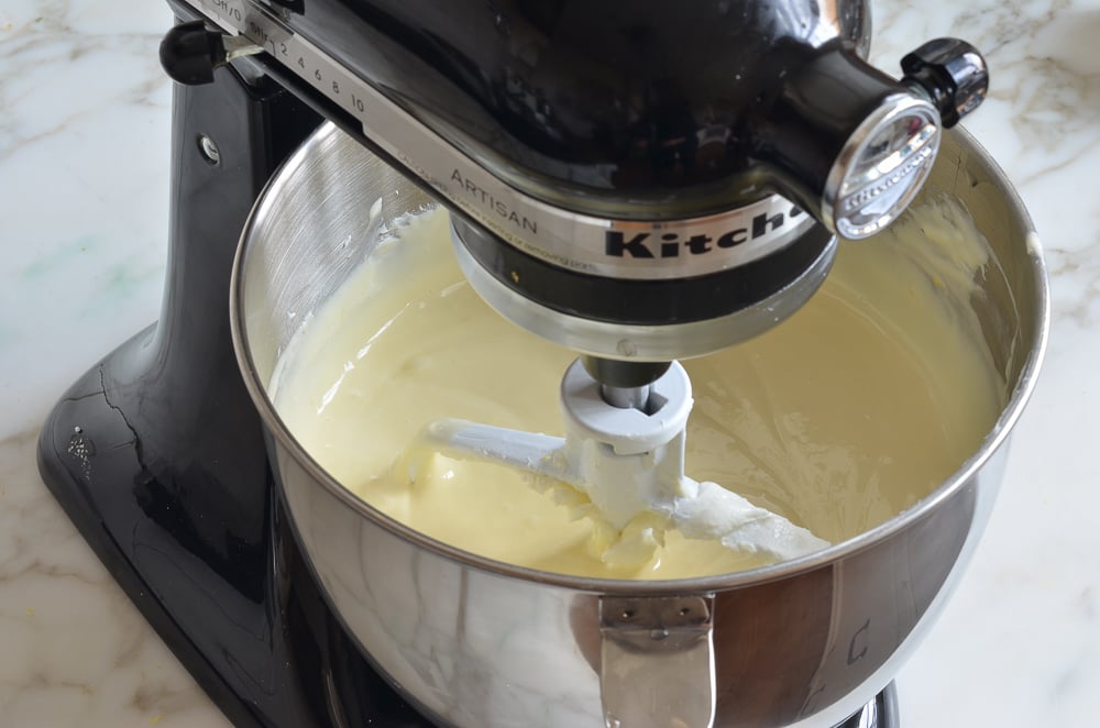 Stand mixer full of cheesecake batter.