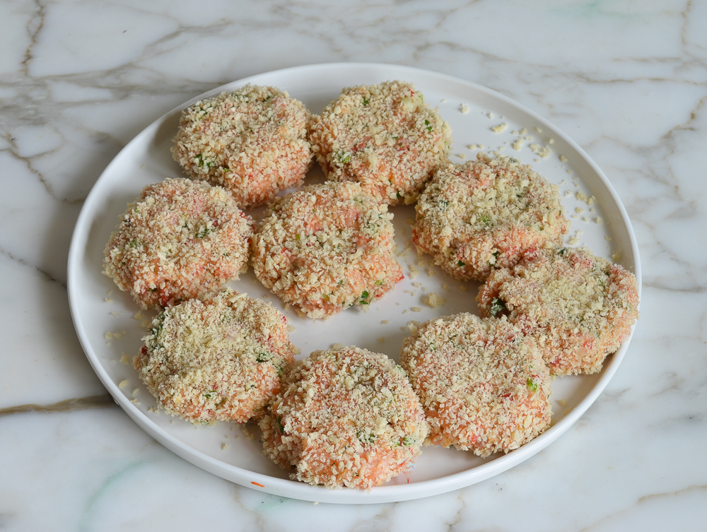 salmon cakes on a plate ready to pan fry