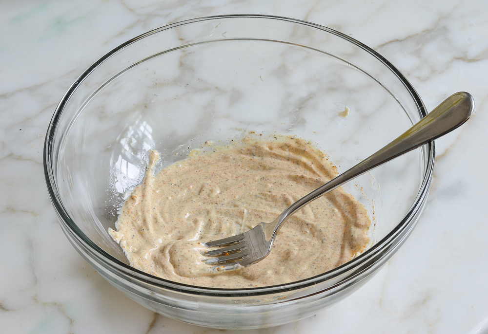 whisked mayonnaise and seasoning for salmon cake mixture