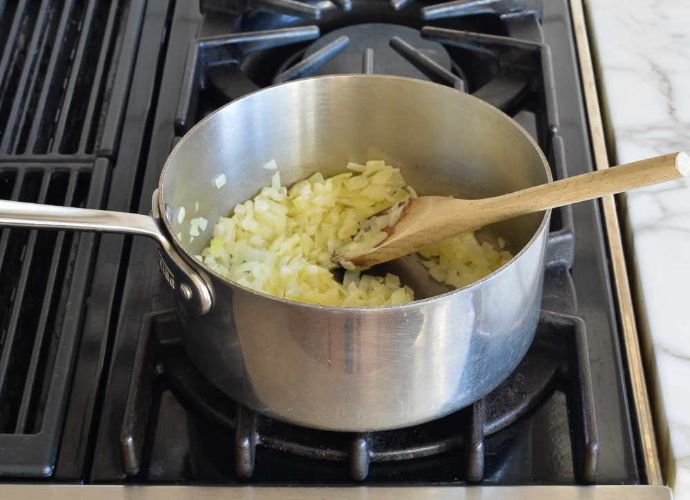 Dices onions cooking in butter.