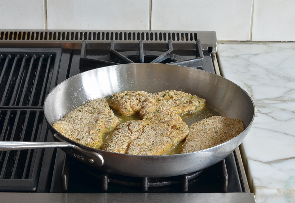 pan-frying the chicken piccata