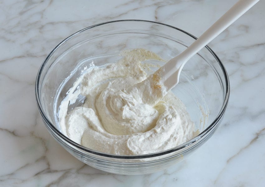 horseradish sauce ingredients mixed together in mixing bowl