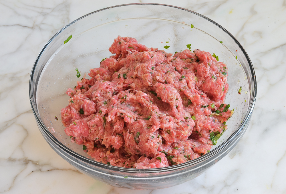 Meat and panko mixture in a bowl.