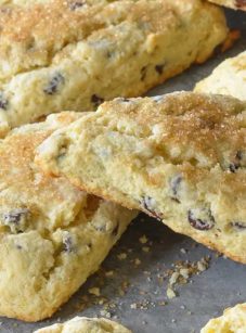 Chocolate chip scones on parchment paper.