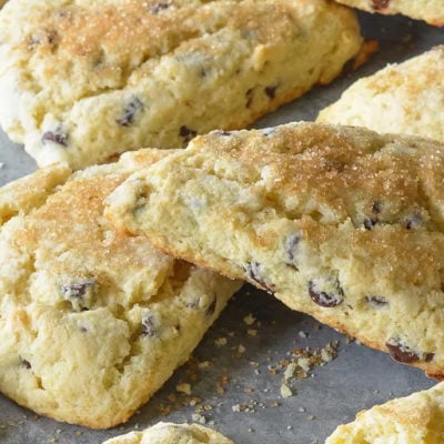Chocolate chip scones on parchment paper.