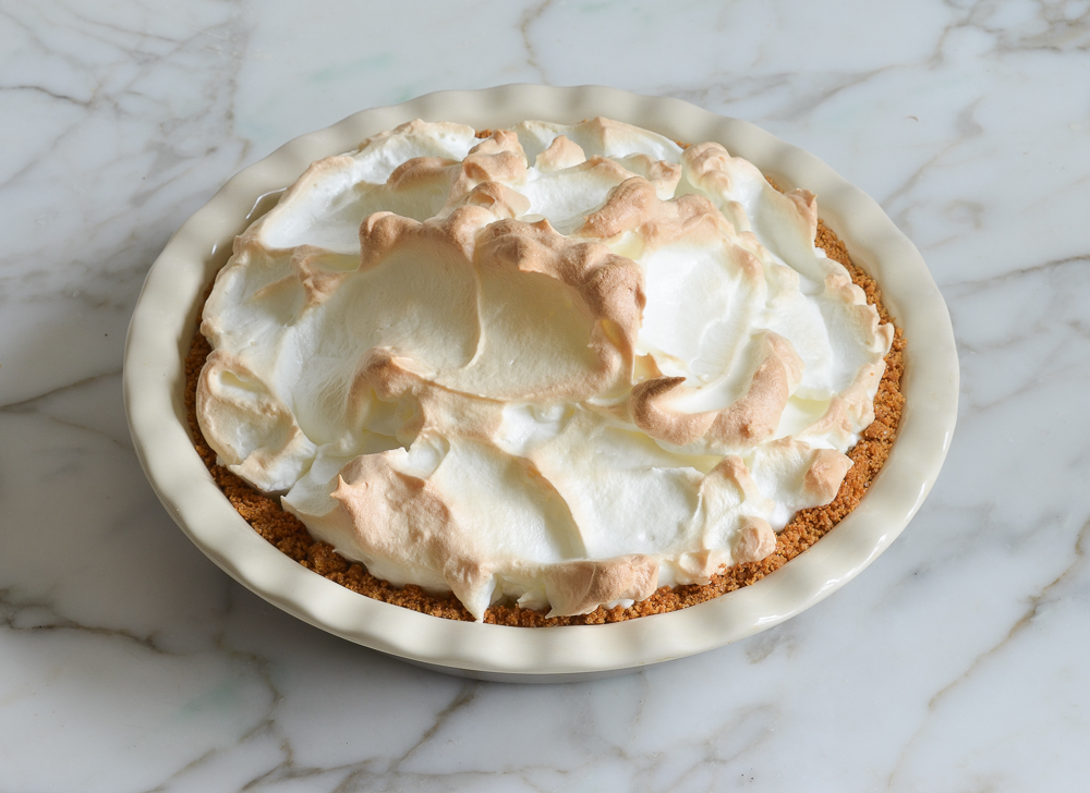 Baked lemon meringue pie in a pie pan.