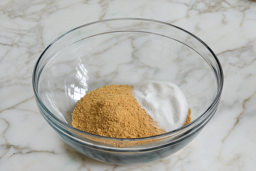 Graham cracker crumbs and sugar in a bowl.